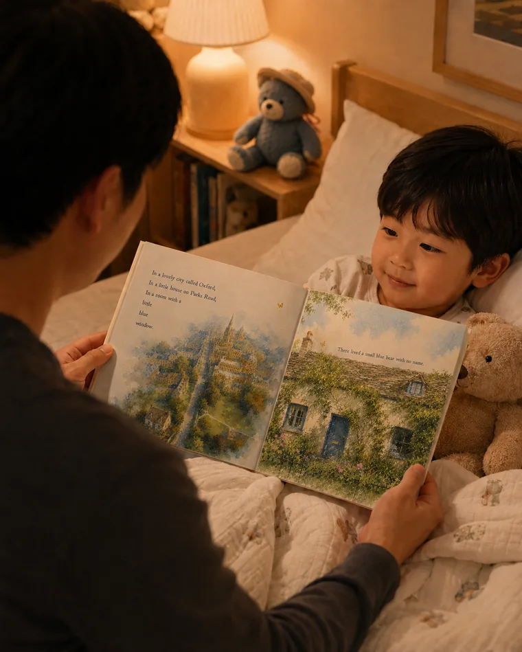 A father reading Bear & Joy to his son at bedtime